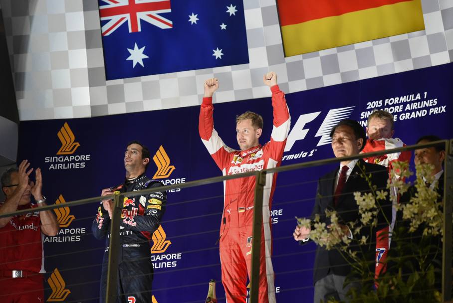 Vettel esulta dopo la vittoria davanti a Ricciardo e Raikkonen. Reuters
